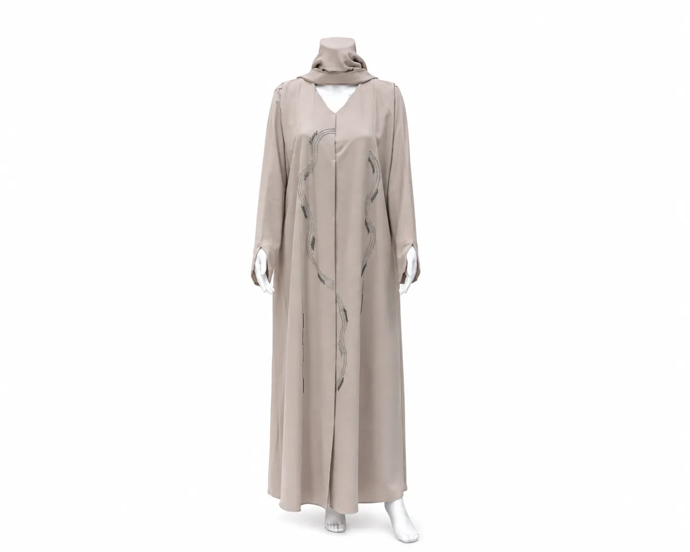 Its Beige Nida Embroidered Abaya is a premium, minimalist garment designed for elegant formal or evening wear.